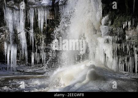 A Partially Frozen Summerhill Force Viewed from Inside Gibson’s Cave, Teesdale, County Durham, UK Stock Photo