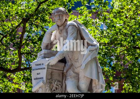 William Shakespeare marble statue erected in 1874 in Leicester Square Gardens London England UK which is a popular tourist travel destination attracti Stock Photo