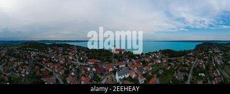 Aerial 180 degrees panoramic photo about Tihany city. Lake Balaton on the background. famous tourist destination with Hungarian monuments church and h Stock Photo