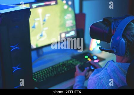 Pro woman egame cyber playing online with virtual reality headset and  wireless controller. Virtual space shooter championship in cyberspace,  esports player performing on pc during gaming tournament Stock Photo - Alamy