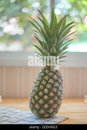 Pineapple on the wooden table Stock Photo