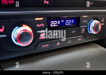 Modern car four zone automatic climate control panel for driver and passengers with air distribution, blower, seat heating, seat ventilation windows Stock Photo