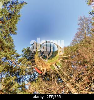 green tiny planet transformation of spherical panorama 360 degrees. Spherical abstract aerial view on forest. Curvature of space. Stock Photo
