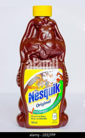 Nesquik chocolate syrup in a bunny shape bottle design. The syrup is most enjoyed with ice cream and to stir with milk. Stock Photo