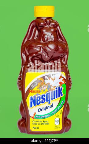 Nesquik chocolate syrup in a bunny shape bottle design. The syrup is most enjoyed with ice cream and to stir with milk. Stock Photo