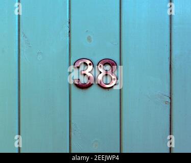 House Number 38 on Wooden Gate. Queen's Road, Fellside, Kendal, Cumbria, England, United Kingdom, Europe. Stock Photo