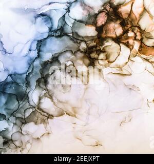 Alcohol ink waves background in subtle tones of blue, brown and orange. White background with space for text. Stock Photo