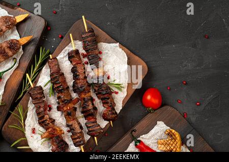 Grilled meat skewers barbecue served on board Stock Photo