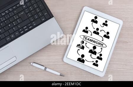 Teamwork concept shown on a digital tablet Stock Photo