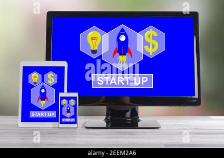 Start up concept shown on different information technology devices Stock Photo