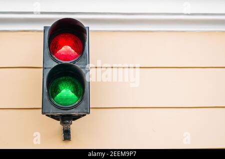 Two color traffic light on the wall Stock Photo