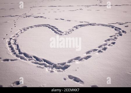 heart made of footprints on a snowy field, Hagen, North Rhine-Westphalia, Germany.  Herz aus Fussabdruecken auf einem verschneiten Feld, Hagen, Nordrh Stock Photo