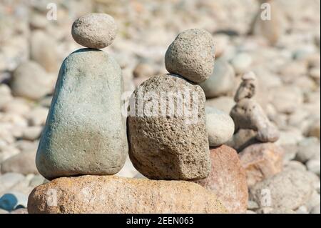 Oxbow Park along the Sandy River in Oregon the rocky shoreline invites visitors to add to the locals favorite passtime of stacking rocks. Stock Photo