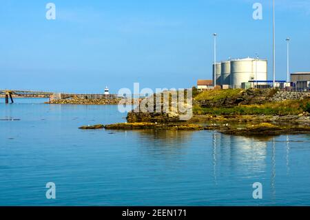 Part of the harbour near Salt Island. The fuel storage takes for the ferries are in view Stock Photo