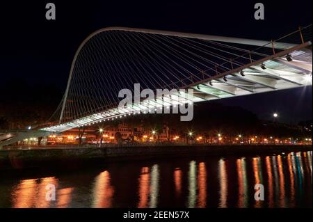 Night image of the Zubizuri bridge across the Nervion River in Bilbao, Spain. Stock Photo