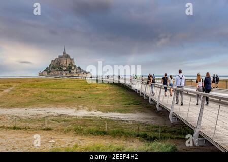 Mont Saint-Michel, France; July 24th 2020 - Vistors walking towards Mont Saint-Michel, Normandy, France Stock Photo