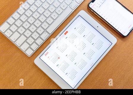 Electronic calendars and computers with open calendars Stock Photo