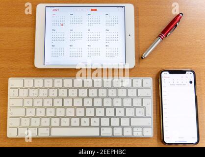 Electronic calendars and computers with open calendars Stock Photo