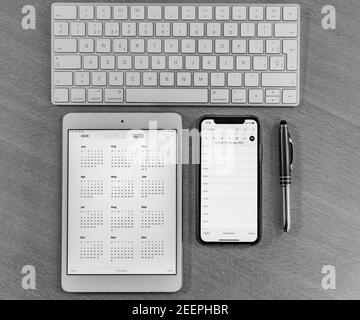 Electronic calendars and computers with open calendars Stock Photo