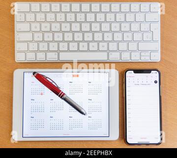 Electronic calendars and computers with open calendars Stock Photo
