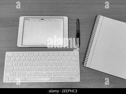 Electronic calendars and computers with open calendars Stock Photo