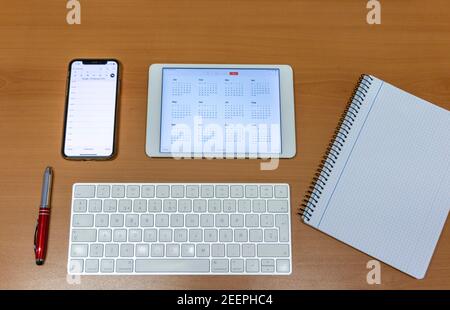 Electronic calendars and computers with open calendars Stock Photo