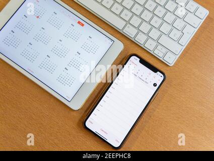 Electronic calendars and computers with open calendars Stock Photo