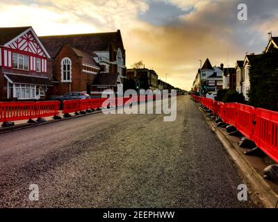 Poole, UK. 16th Feb, 2021. Bournemouth, UK. Tuesday 16 February 2021. Usually busy Ashley Road, connecting Bournemouth and Poole, is closed for resurfacing. Credit: Thomas Faull/Alamy Live News Stock Photo