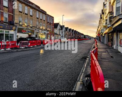 Poole, UK. 16th Feb, 2021. Bournemouth, UK. Tuesday 16 February 2021. Usually busy Ashley Road, connecting Bournemouth and Poole, is closed for resurfacing. Credit: Thomas Faull/Alamy Live News Stock Photo