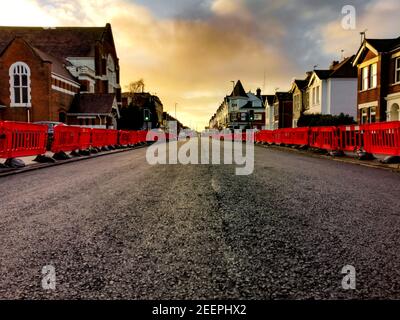 Poole, UK. 16th Feb, 2021. Bournemouth, UK. Tuesday 16 February 2021. Usually busy Ashley Road, connecting Bournemouth and Poole, is closed for resurfacing. Credit: Thomas Faull/Alamy Live News Stock Photo