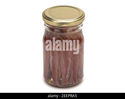 Salted anchovies in a glass jar on white Stock Photo