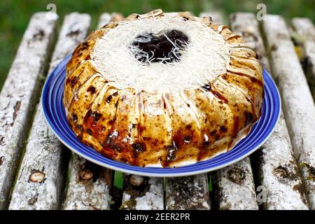 coconut cake with plums Stock Photo