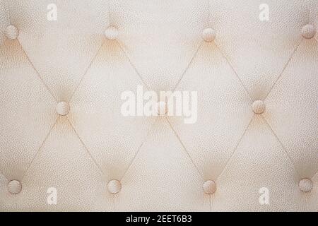 Fabric background of a sofa or bed close-up. Grey fabric pattern. Abstract background for furniture. Background photos of upholstered furniture. Stock Photo