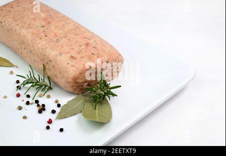 Raw meatloaf on white background. Top view. Copy space. Stock Photo