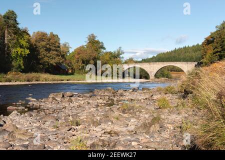 The Potarch Bridge Over the River Dee in Aberdeenshire on a Sunny Autumn Day Seen From the Riverbank Stock Photo