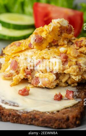 scrambled eggs on a rye bread Stock Photo