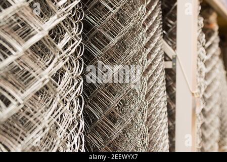 Black metal mesh wire security grille, shop, store Stock Photo