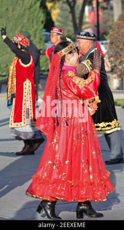 Dancers in Uyghur-style clothing at the city's Main Square. Zhangye-Gansu-China-1229 Stock Photo