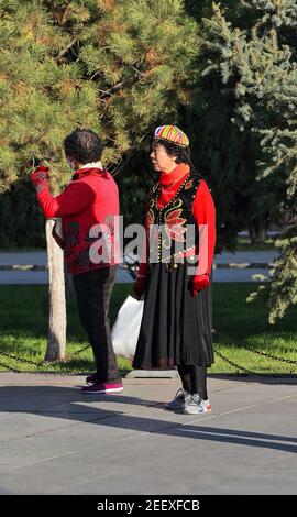 Dancers in Uyghur-style clothing at the city's Main Square. Zhangye-Gansu-China-1240 Stock Photo