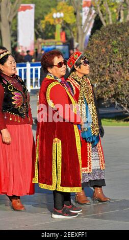 Dancers in Uyghur-style clothing at the city's Main Square. Zhangye-Gansu-China-1241 Stock Photo