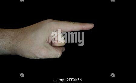 Hand pointing in the right direction. Advertising and marketing concept. Hand gesture isolated on black background. Advertisement attention concept. Stock Photo