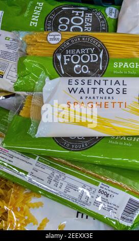 Packets of spaghetti and pasta in a crate of dry packet food donations in a Trussell Trust foodbank. Stock Photo