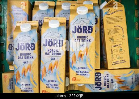 A crate of Jord Nordic Oat Milk drink cartons, an organic, non-dairy milk alternative, as part of food donations to a Trussell Trust foodbank. UK Stock Photo