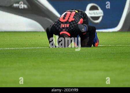 Budapest, Hungary. 16th Feb, 2021. Football: Champions League, knockout round, round of 16, first leg, RB Leipzig - Liverpool FC at Puskas Arena. Liverpool's Sadio Mane celebrates after scoring the 0:2 goal. Credit: Marton Monus/dpa/Alamy Live News Stock Photo