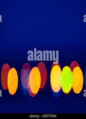 abstract background with natural bokeh road street lights at blue hour Stock Photo