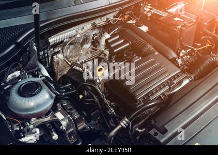 View under car hood at modern turbocharged eco-friendly engine or motor close up. Stock Photo