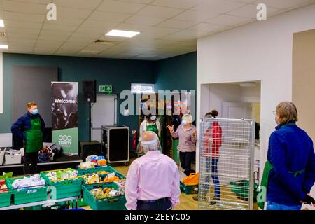 Volunteers at a Trussell Trust foodbank volunteering to collect, sort and organise donated food to be given out to the local community in Colindale UK Stock Photo