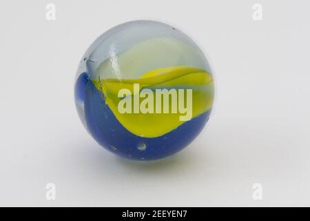Macro image of a glass marble on a white background Stock Photo