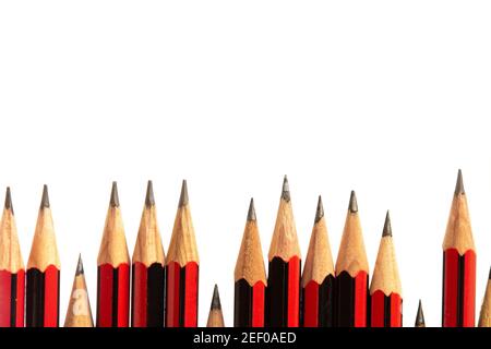Close up of an uneven line of black and red lead pencils Stock Photo