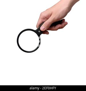 Hand holding a magnifying glass isolated. Close up Stock Photo